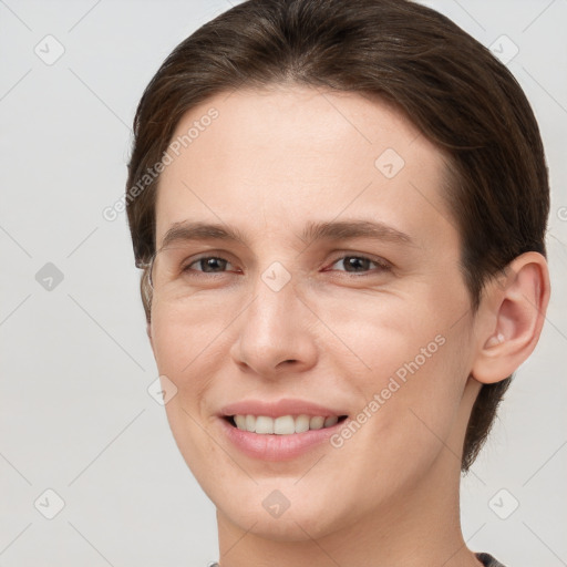 Joyful white young-adult female with short  brown hair and brown eyes