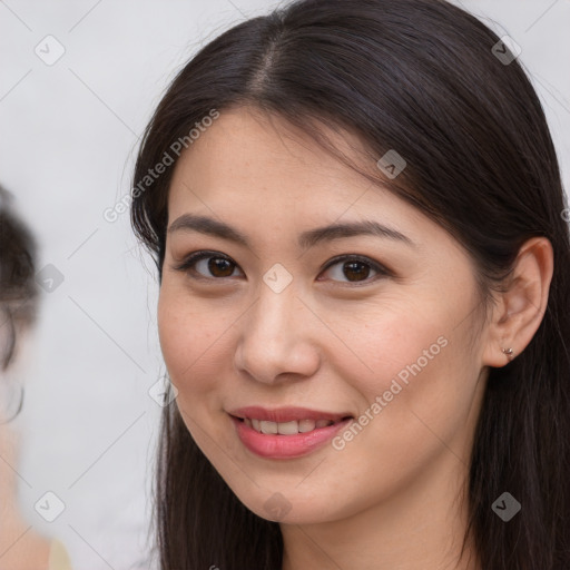 Joyful white young-adult female with long  brown hair and brown eyes