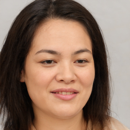 Joyful white young-adult female with medium  brown hair and brown eyes