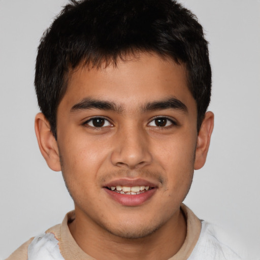 Joyful latino young-adult male with short  brown hair and brown eyes