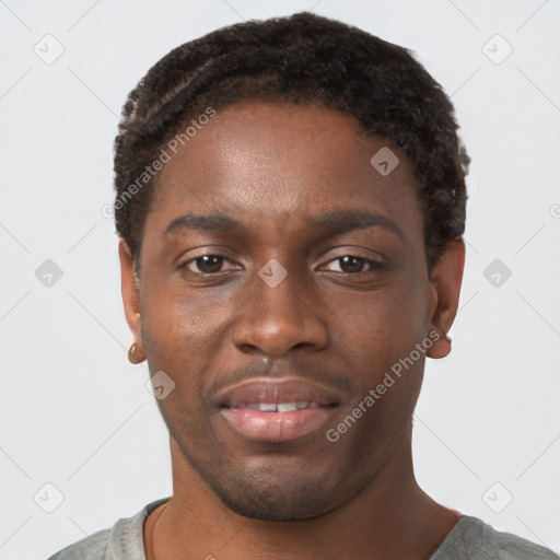 Joyful black young-adult male with short  brown hair and brown eyes