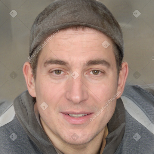 Joyful white adult male with short  brown hair and grey eyes