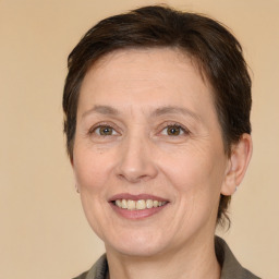 Joyful white adult female with medium  brown hair and brown eyes