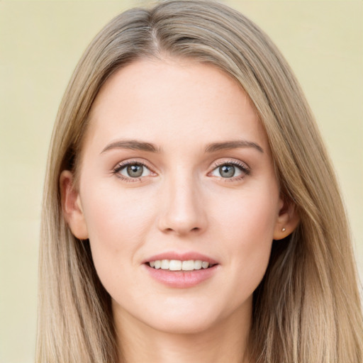 Joyful white young-adult female with long  brown hair and green eyes