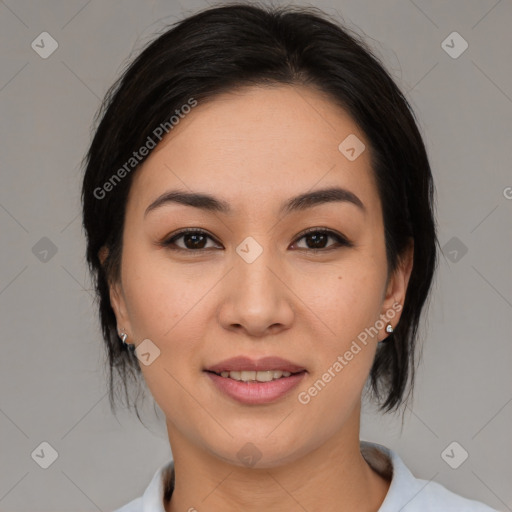 Joyful asian young-adult female with medium  black hair and brown eyes