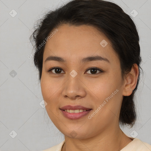 Joyful latino young-adult female with medium  brown hair and brown eyes