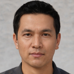 Neutral asian adult male with short  black hair and brown eyes