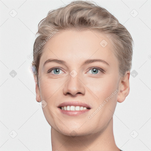 Joyful white young-adult female with short  brown hair and blue eyes