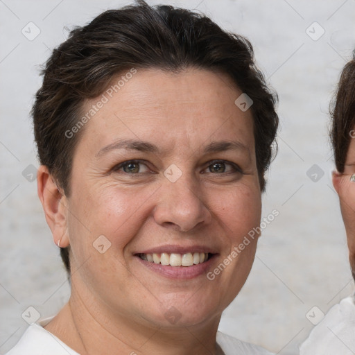 Joyful white adult female with short  brown hair and brown eyes