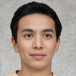 Joyful asian young-adult male with short  brown hair and brown eyes