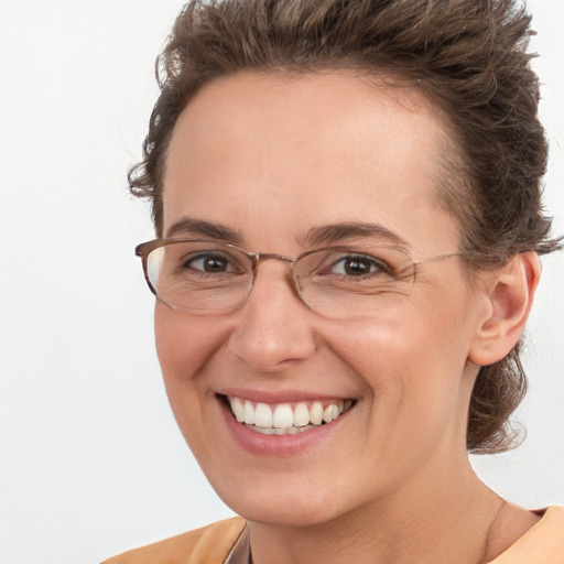 Joyful white adult female with short  brown hair and brown eyes