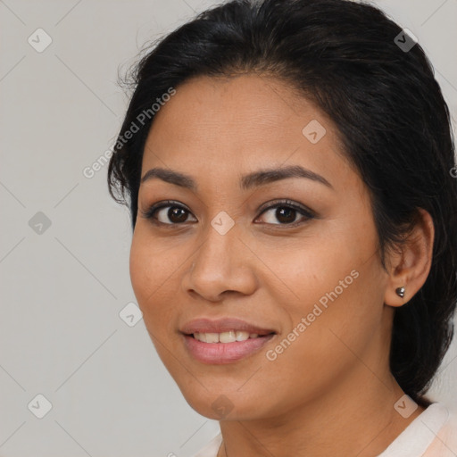 Joyful latino young-adult female with medium  black hair and brown eyes