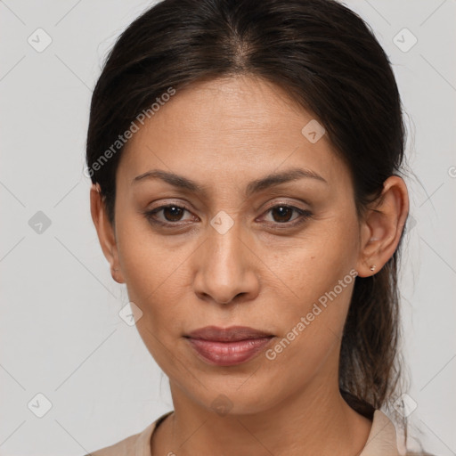 Joyful white adult female with medium  brown hair and brown eyes