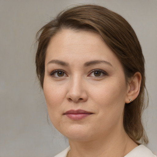 Joyful white young-adult female with medium  brown hair and brown eyes