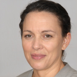 Joyful white adult female with short  brown hair and brown eyes