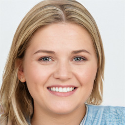 Joyful white young-adult female with medium  brown hair and blue eyes