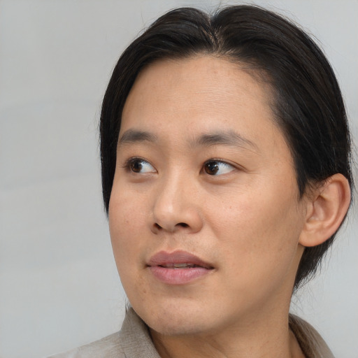 Neutral asian young-adult male with medium  brown hair and brown eyes