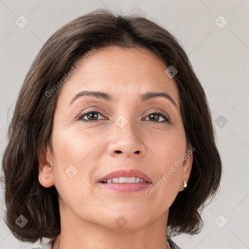 Joyful white adult female with medium  brown hair and grey eyes