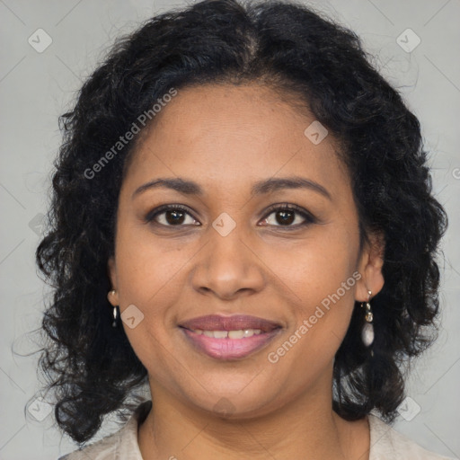 Joyful black young-adult female with long  brown hair and brown eyes