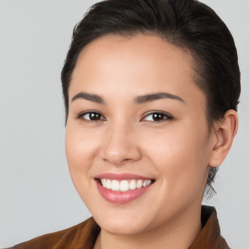 Joyful white young-adult female with medium  brown hair and brown eyes