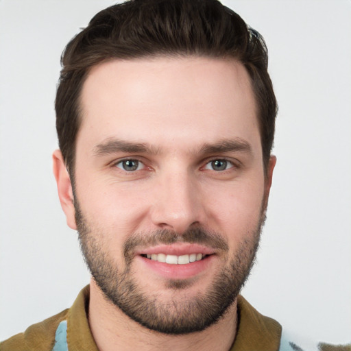 Joyful white young-adult male with short  brown hair and brown eyes