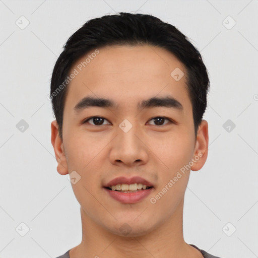 Joyful asian young-adult male with short  black hair and brown eyes