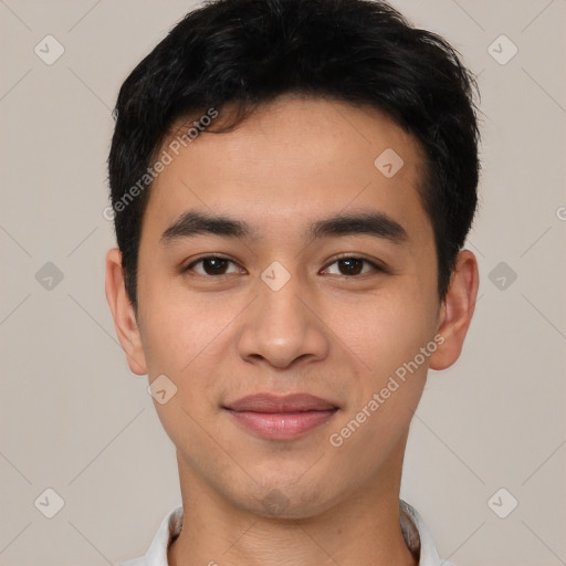 Joyful latino young-adult male with short  black hair and brown eyes