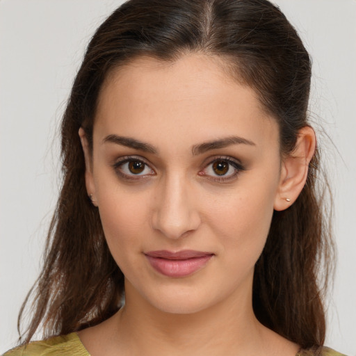 Joyful white young-adult female with medium  brown hair and brown eyes