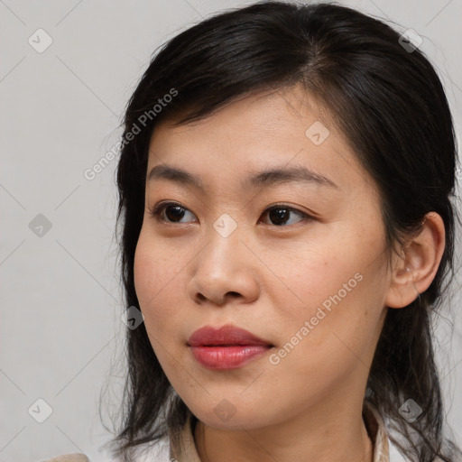 Joyful asian young-adult female with medium  brown hair and brown eyes