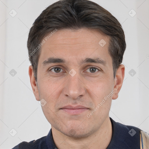 Joyful white adult male with short  brown hair and brown eyes