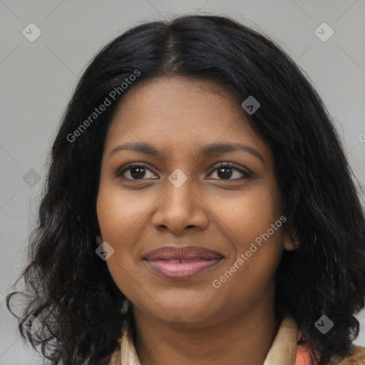 Joyful black young-adult female with long  brown hair and brown eyes