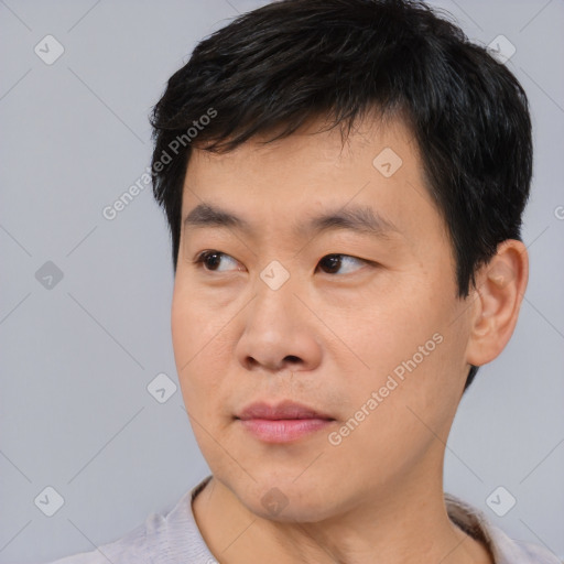 Neutral asian young-adult male with short  black hair and brown eyes