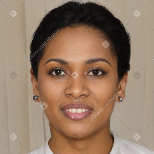 Joyful black young-adult female with short  black hair and brown eyes