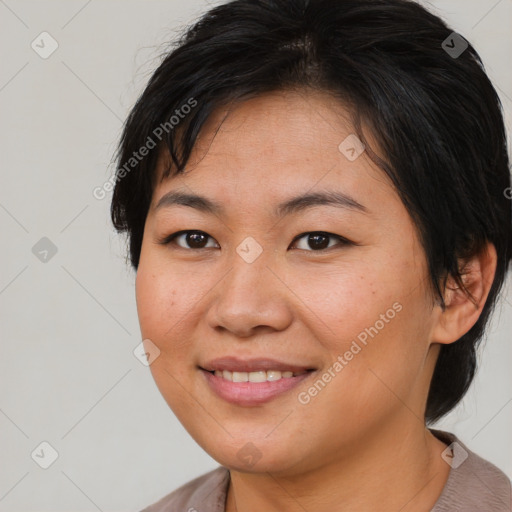 Joyful asian young-adult female with medium  brown hair and brown eyes