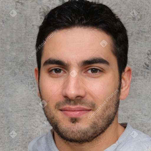 Joyful white young-adult male with short  black hair and brown eyes