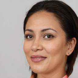 Joyful white adult female with medium  brown hair and brown eyes