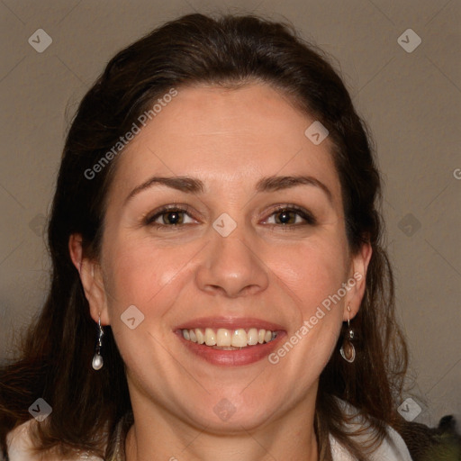 Joyful white adult female with long  brown hair and brown eyes