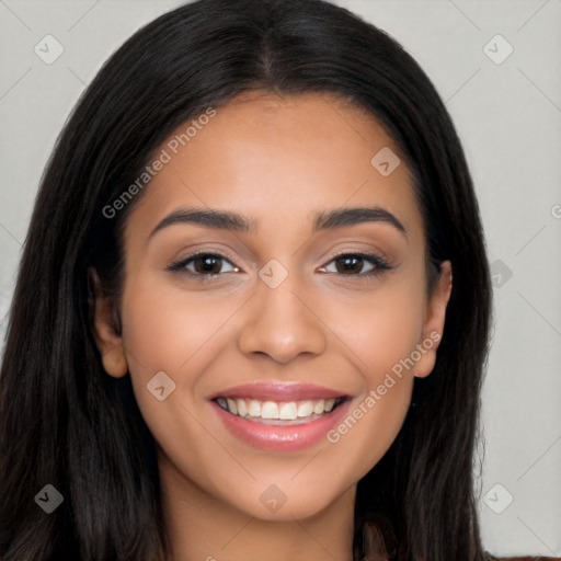 Joyful latino young-adult female with long  brown hair and brown eyes