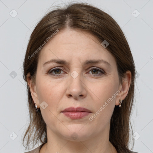 Joyful white adult female with medium  brown hair and grey eyes