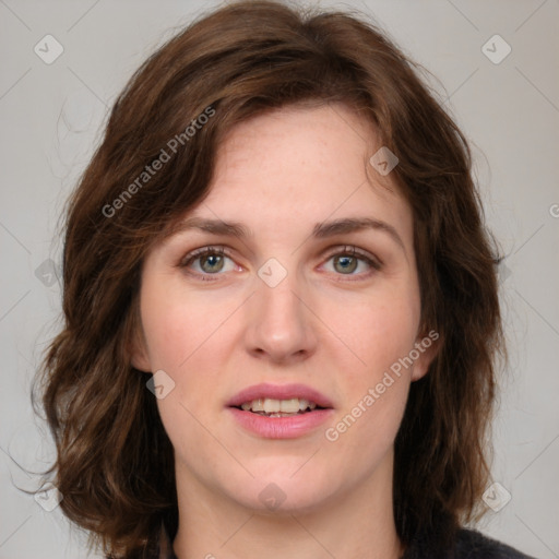 Joyful white young-adult female with medium  brown hair and green eyes