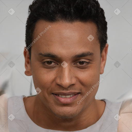 Joyful latino young-adult male with short  brown hair and brown eyes