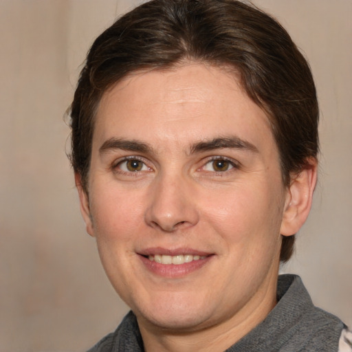 Joyful white adult male with medium  brown hair and brown eyes