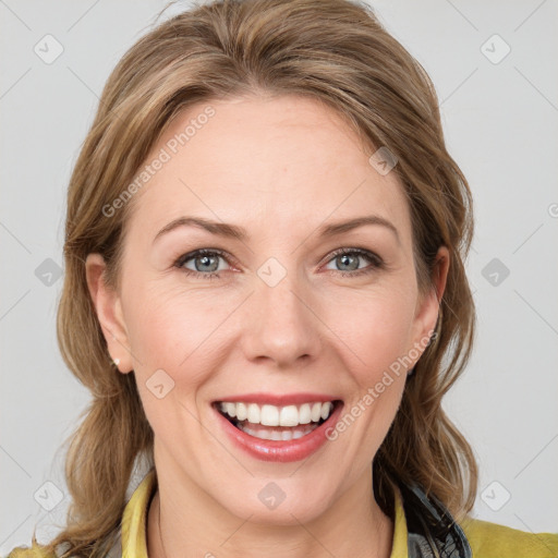 Joyful white young-adult female with medium  brown hair and blue eyes