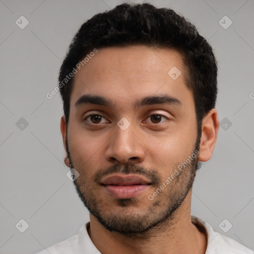 Neutral latino young-adult male with short  black hair and brown eyes