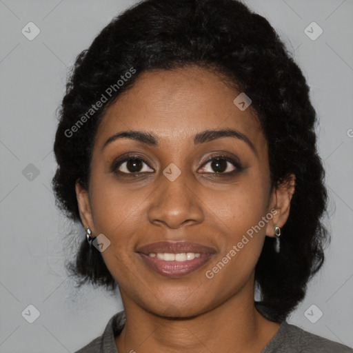 Joyful black young-adult female with short  black hair and brown eyes