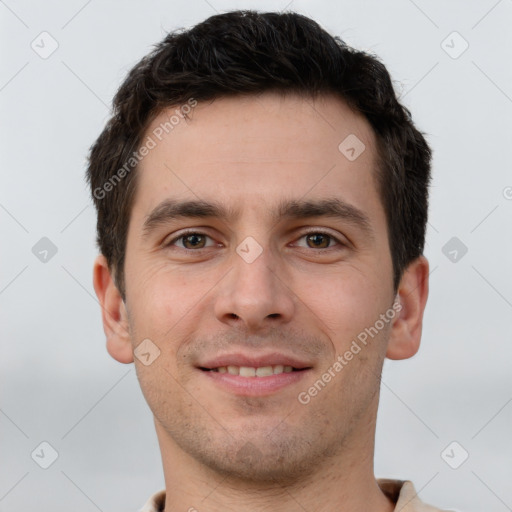 Joyful white young-adult male with short  brown hair and brown eyes