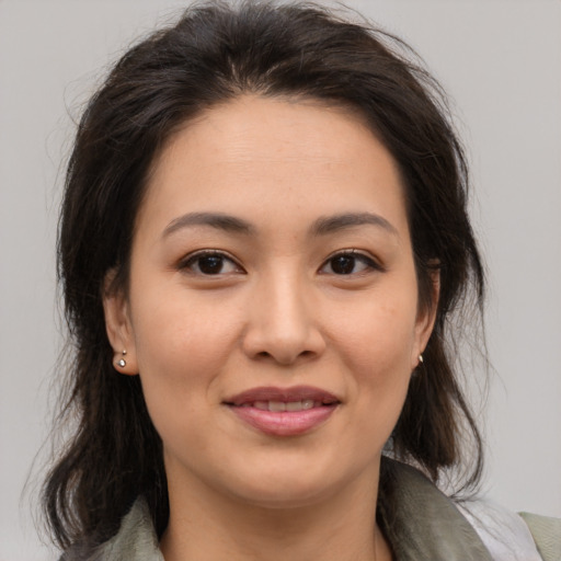 Joyful asian young-adult female with medium  brown hair and brown eyes