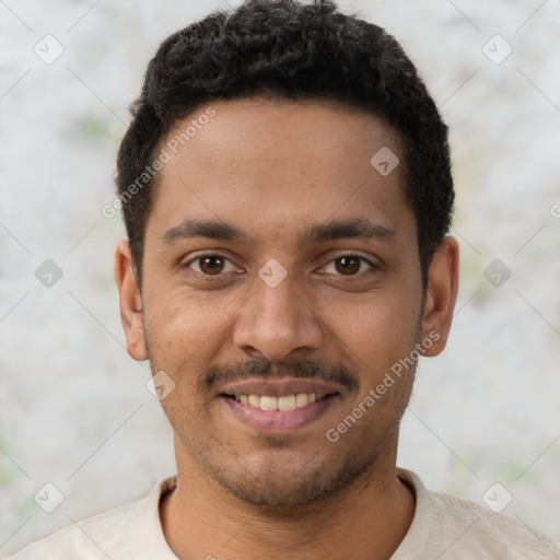 Joyful latino young-adult male with short  brown hair and brown eyes