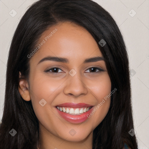 Joyful latino young-adult female with long  brown hair and brown eyes