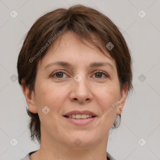 Joyful white adult female with medium  brown hair and brown eyes